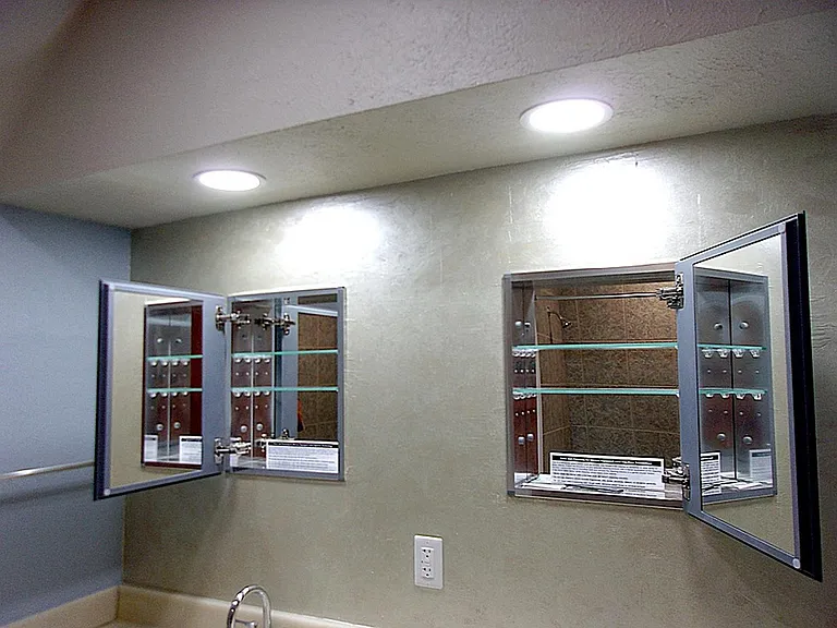 Double Medicine Cabinets with mirrored sides and backs.