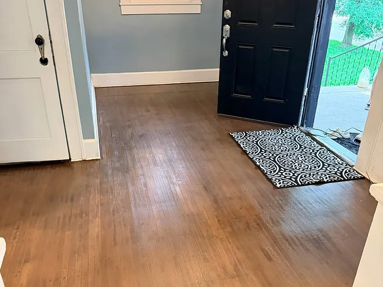 front door with freshly refinished hardwoods