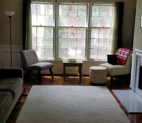 Beautiful living space with working fireplace and crown mold