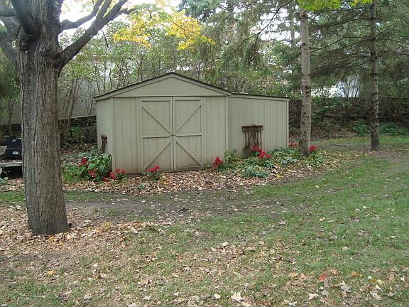 2 sheds in back yard. Lots of storage! Back shed perfect for lawn tractor. Both have double doors! And shelving. One  shed 11 x 9 1/2 other 7 x 8.