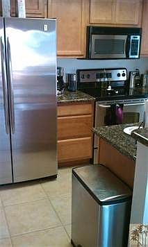 Kitchen has granite countertops and 18" tile flooring.