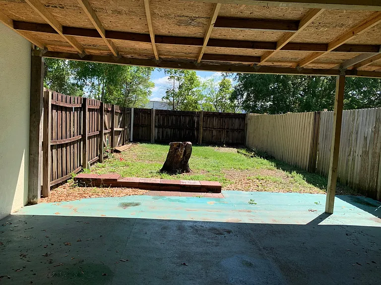Nice covered patio to enjoy the Florida weather in the backyard.