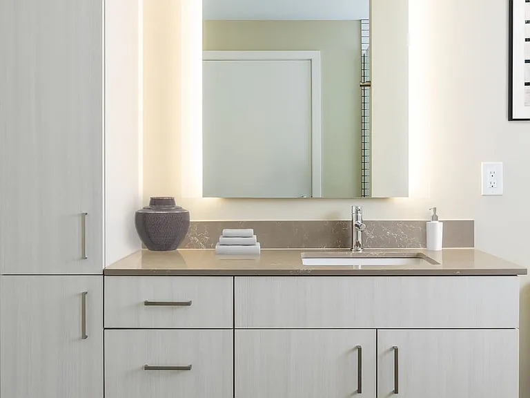 Scheme I bath with white cabinetry, quartz countertop, and hard surface flooring.