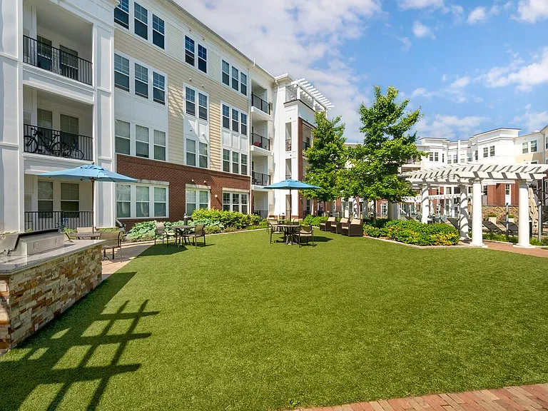 Courtyard with barbecue grill and dining area