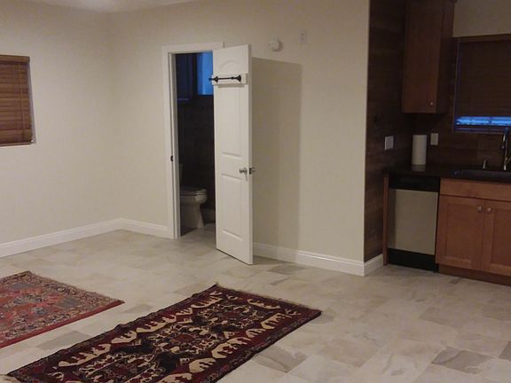 Main room, looking at entrance to shower and restroom