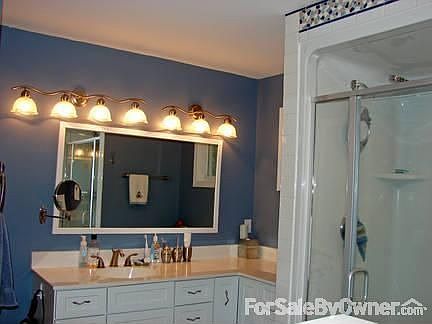 Main Master Bathroom : Vanities on each side of room; 5' shower with glass doors, ceramic tile floor