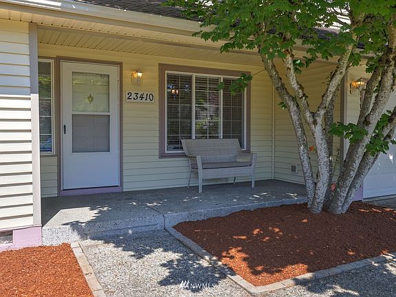 A welcoming front porch graces the home as you enter.