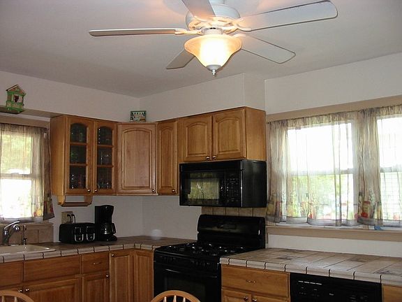Oak Cabinets- Ceramic tiles/counter