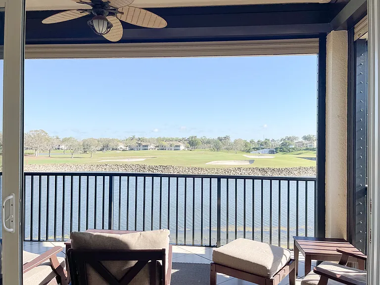 Private Lanai with panoramic screening overlooking 18th green of the Mustang Course at Lely Resort
