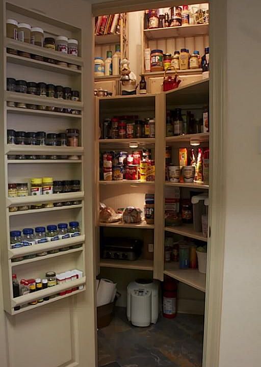 Walk-in Pantry with a spice rack on the door