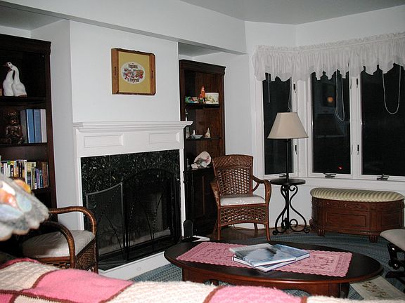 LIVING W/BAY WINDOWS & FIREPLACE