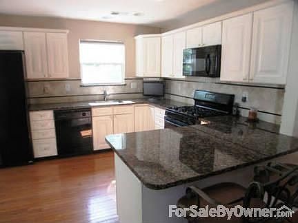 Kitchen
						:
						Eat in kitchen and breakfast bar. Brand new wood floors