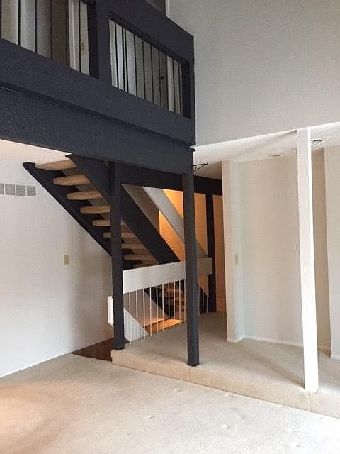 Living room towards stairs.