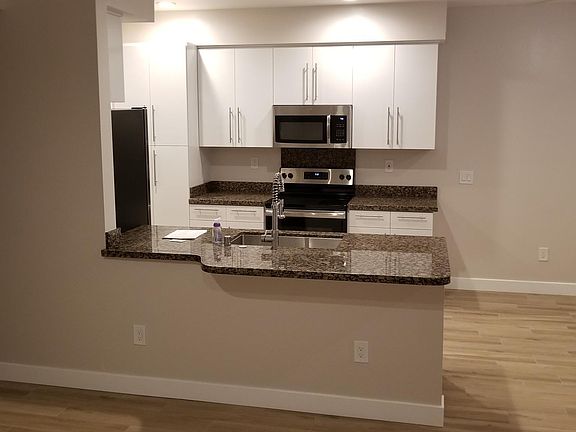 Kitchen with granite pass through bar
