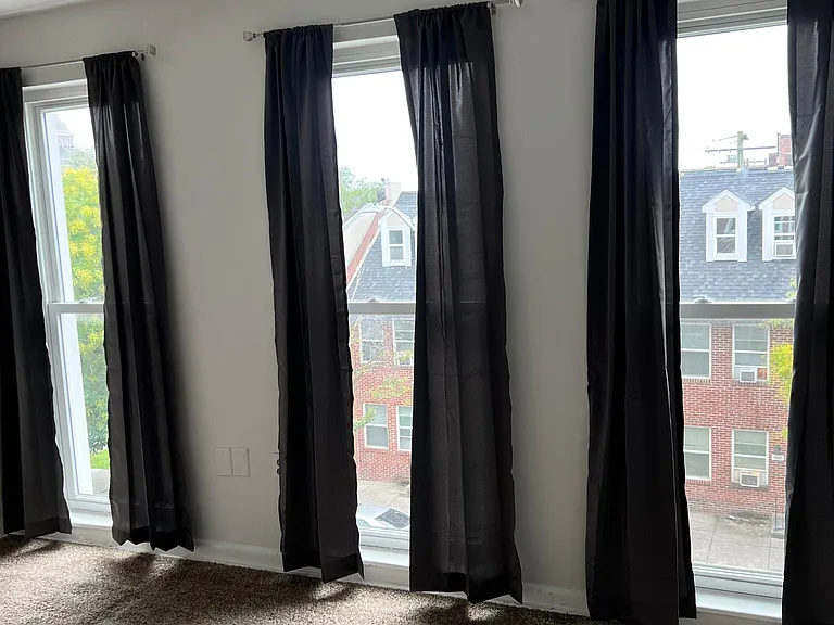 Head to the 3rd floor to find the 2nd bedroom with floor to ceiling windows