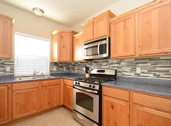 Gas range and built-in microwave. Tons of cabinet strorage!