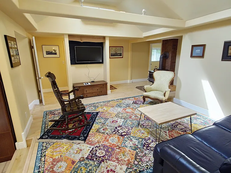 Airy living room with Roku TV, WiFi and comfy furniture.