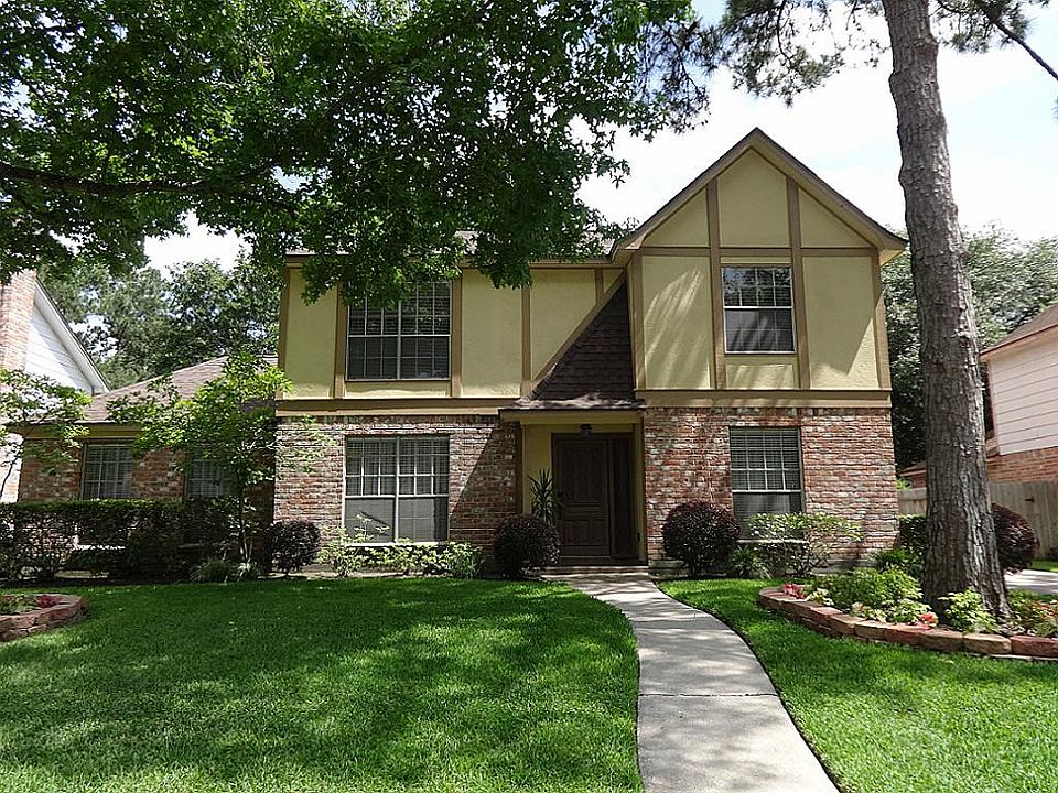 This CUSTOM Woodcreek home is elegance surrounded by lush greenery and mature trees. No need to water the lawn... front and back yard are fully irrigated on a timer.