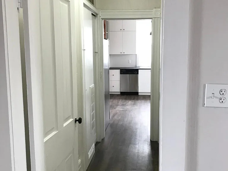 Hallway between kitchen and bedroom #2 (laundry and bathroom
