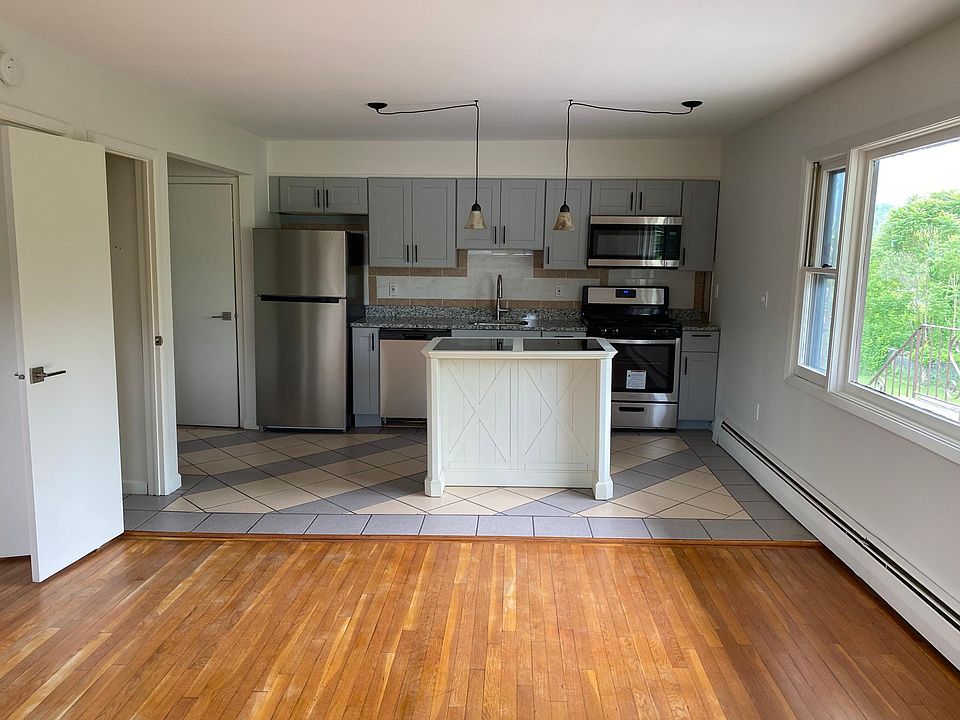 Brand new kitchen! View from living room. 2 Storage closets on left! Storage in island too!