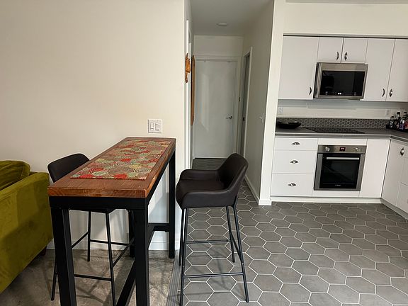 Kitchen area, and the hallway to the bedroom.