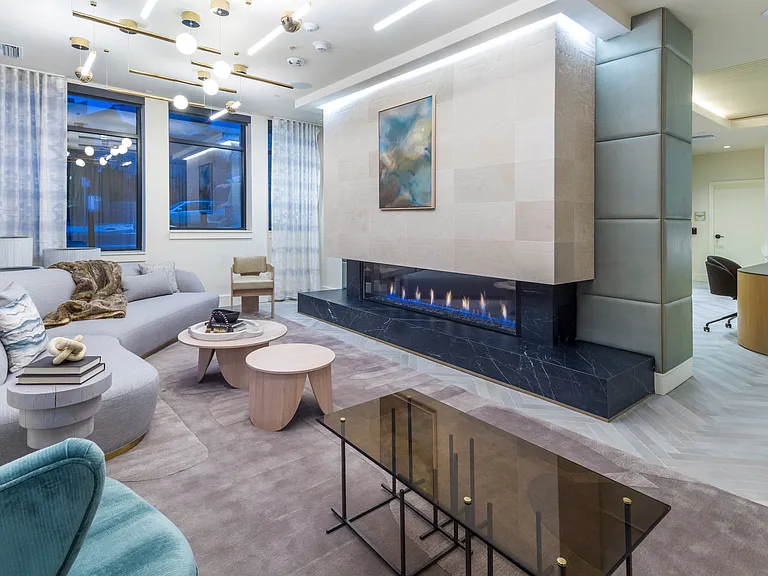 Lobby with sleek fireplace and plush seating areas