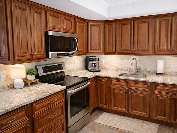 Update Kitchen. Granite Counter Tops, Undercount Sink. Stainless appliances. Washer & Dryer. Opening up to the Dinning Room and Living Room.