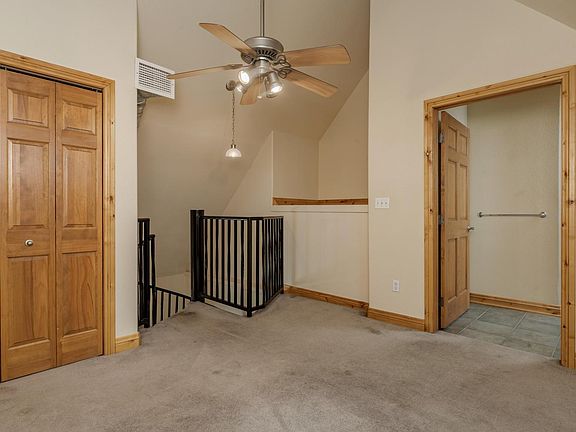 Main bedroom upstairs, loft with closet and attached full bath with tub.
