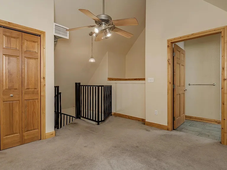 Main bedroom upstairs, loft with closet and attached full bath with tub.