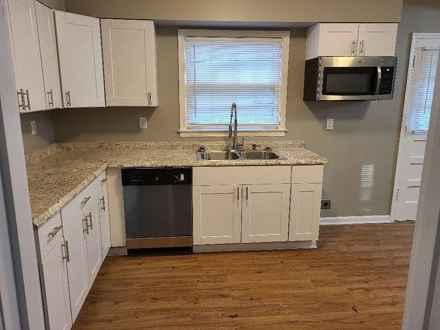 4 Success now offering this 3 bedroom 2bath home with an open floor plan renovated bathrooms and ... — Photo 4