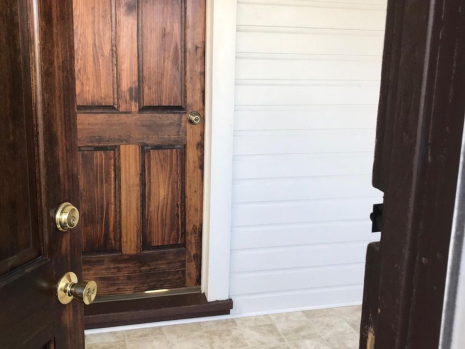 Front door leading to kitchen