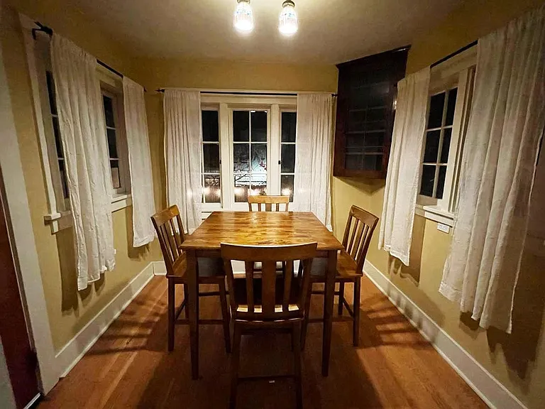 Very cute and cozy dining area, with 3 big windows looking into back yard / outside