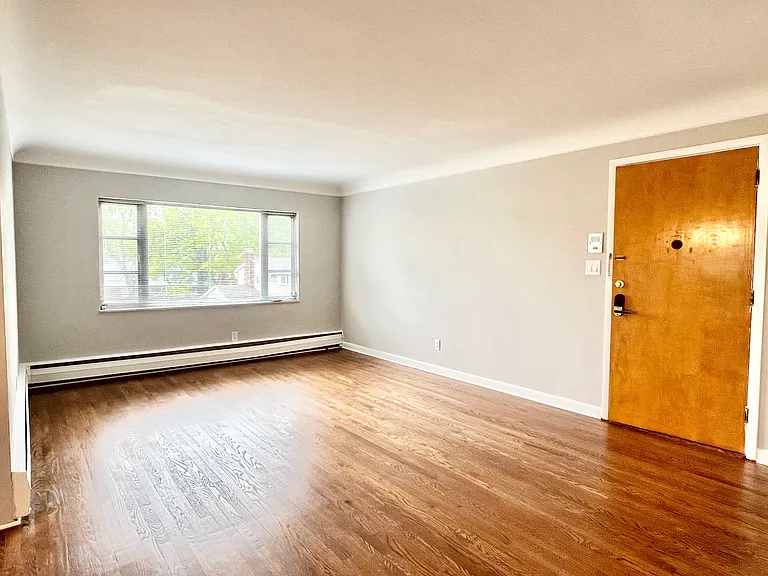 Enter the apartment door into the spacious living room