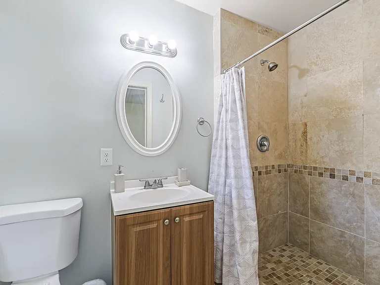 Modern bathroom with glass shower and warm finishes for a cozy daily reset