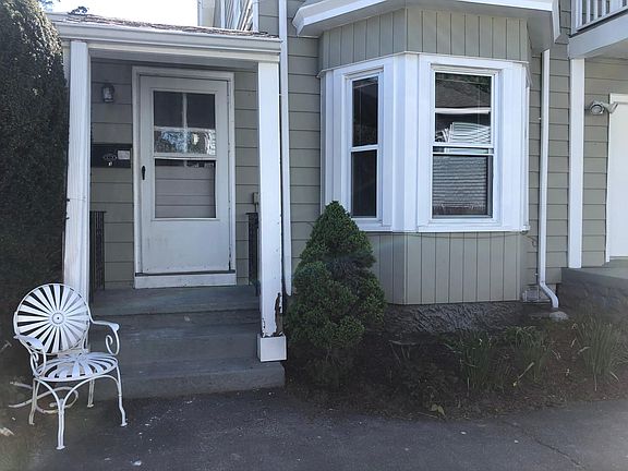 Entrance to Unit 3: loving room windows on right.