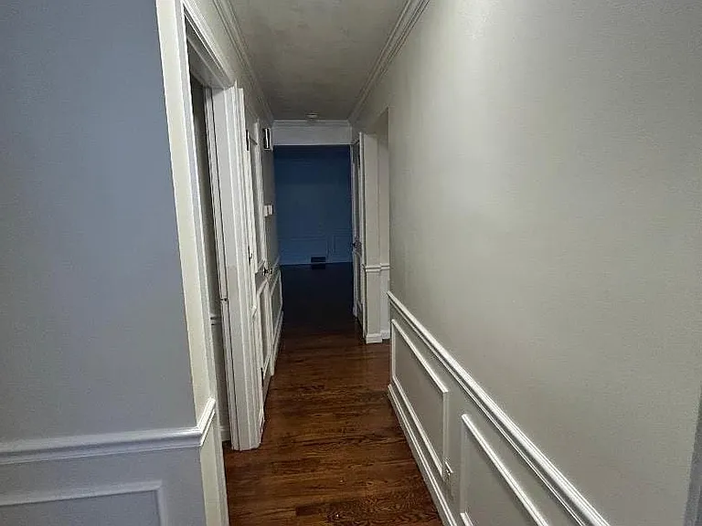Hallway with hardwood floors