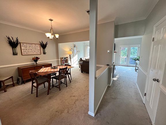 Second floor dining room and living room (half bath through door on right).
