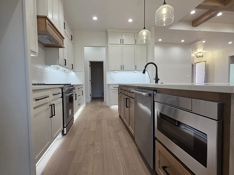 Kitchen features stainless steel appliances, drawer microwave, 3 rack dishwasher & Pro Series gas range