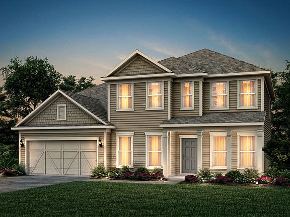 Riverton Exterior 52 features Hardie Board siding, shakes, covered front porch and 2 car garage