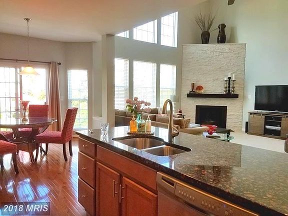 Kitchen with breakfast bar area and family room