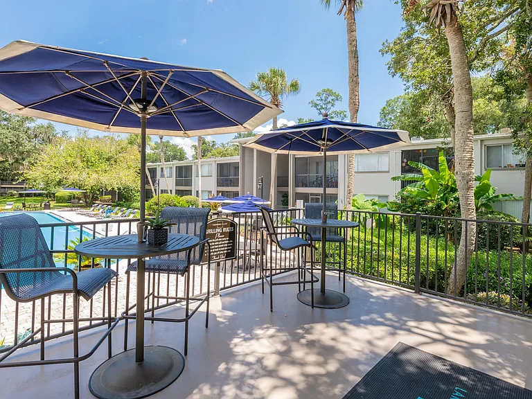 Enjoy lunch at umbrellaed tables overlooking the sparkling pool.