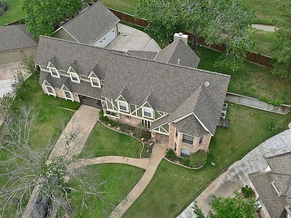 AERIAL VEW SHOWS NEW ROOF, SIZE OF THE LARGE LOT THAT BACKS TO GREEN BELT