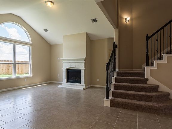Social Family Room with Crackling Fireplace