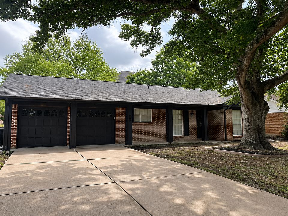 Modern curb appeal with a spacious driveway and fresh exterior updates at 7307 Galleon Dr.