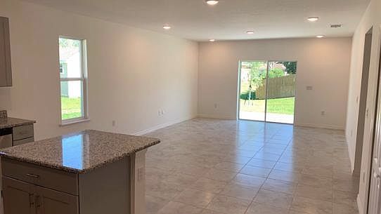 Kitchen island overlooking the great room All granite and c