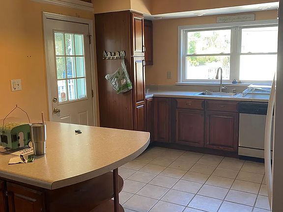 Kitchen with island for meals and extra storage.