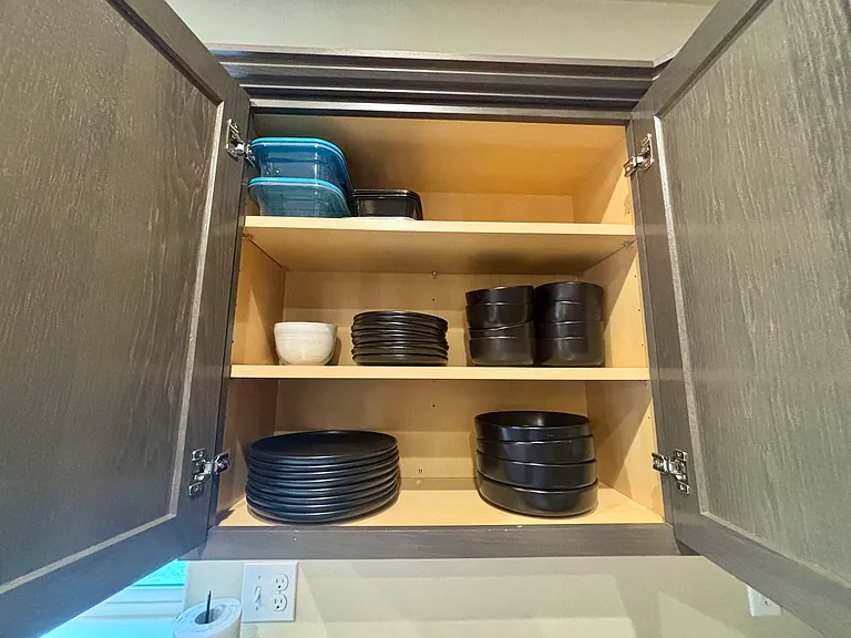 Kitchen is fully stocked with all supplies, utensils, and small appliances