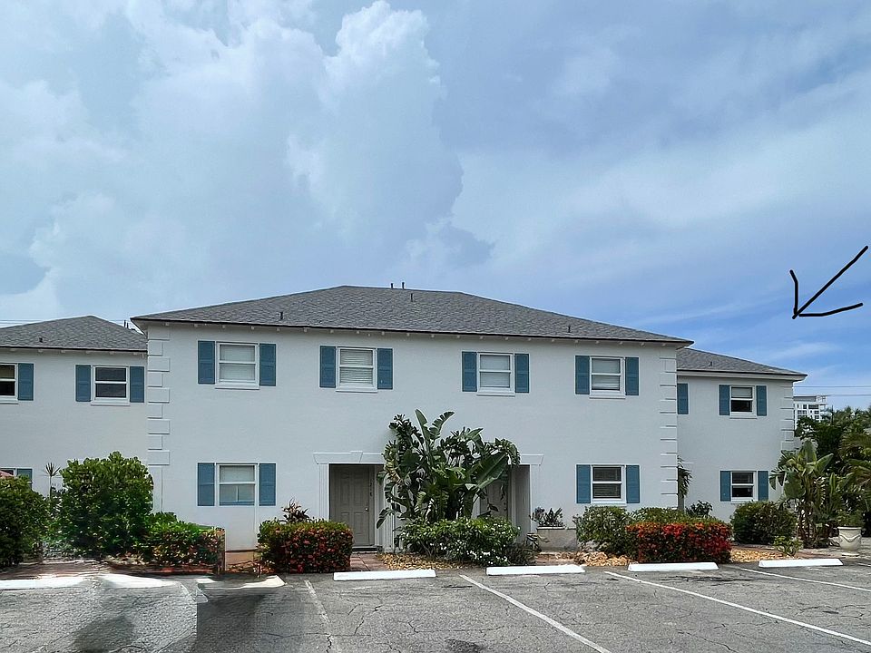 Building exterior, far right unit. Parking in front