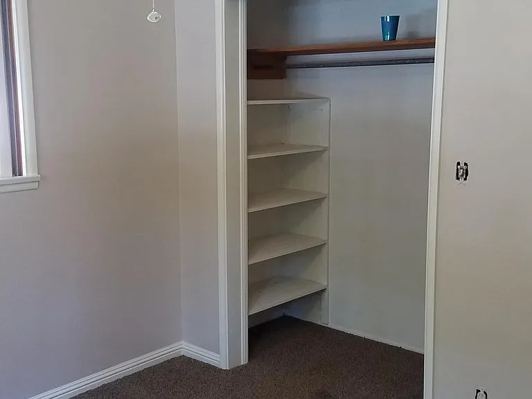 shelving shown inside closet