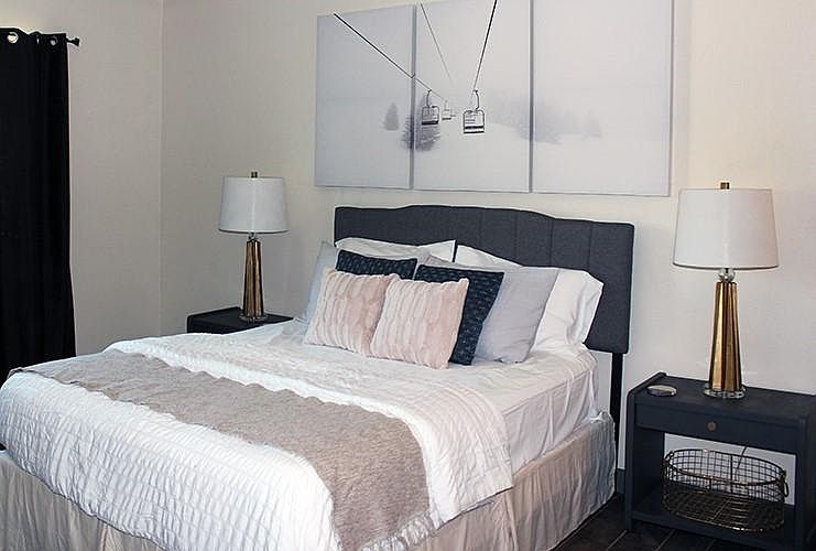 Master bedroom (queen size bed) large dresser and tv/cable in room.